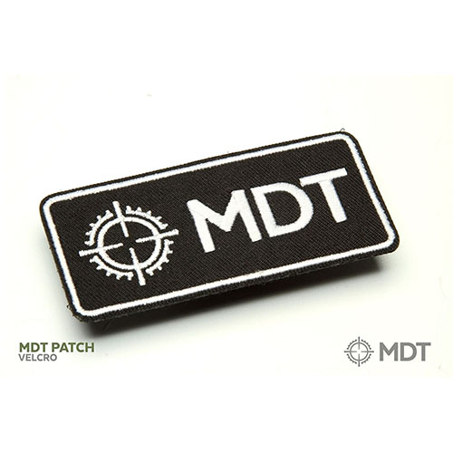 Vyjádřete svou podporu Modular Driven Technologies s tímto stylovým MDT nášivkou - ideální pro batohy, oblečení nebo pouzdra na zbraně.